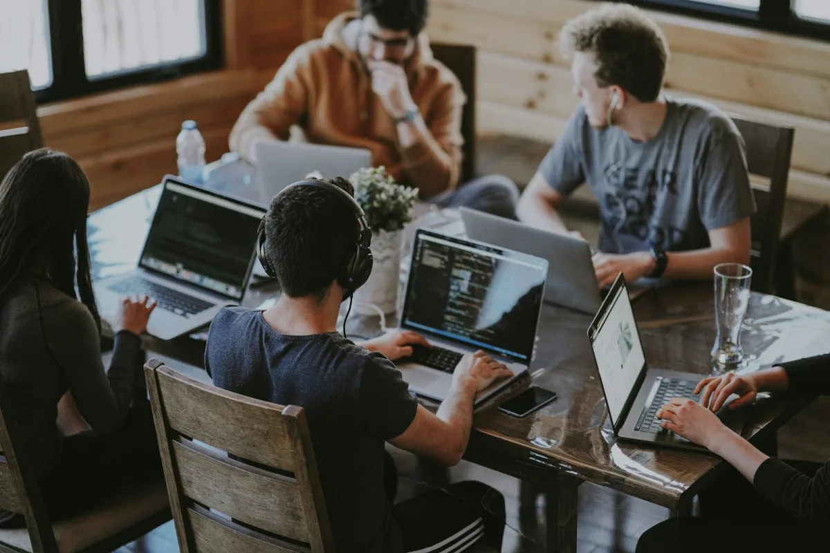 SaaS startup leadership team collaborating on financial growth models and product roadmaps