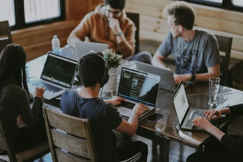 SaaS startup leadership team collaborating on financial growth models and product roadmaps